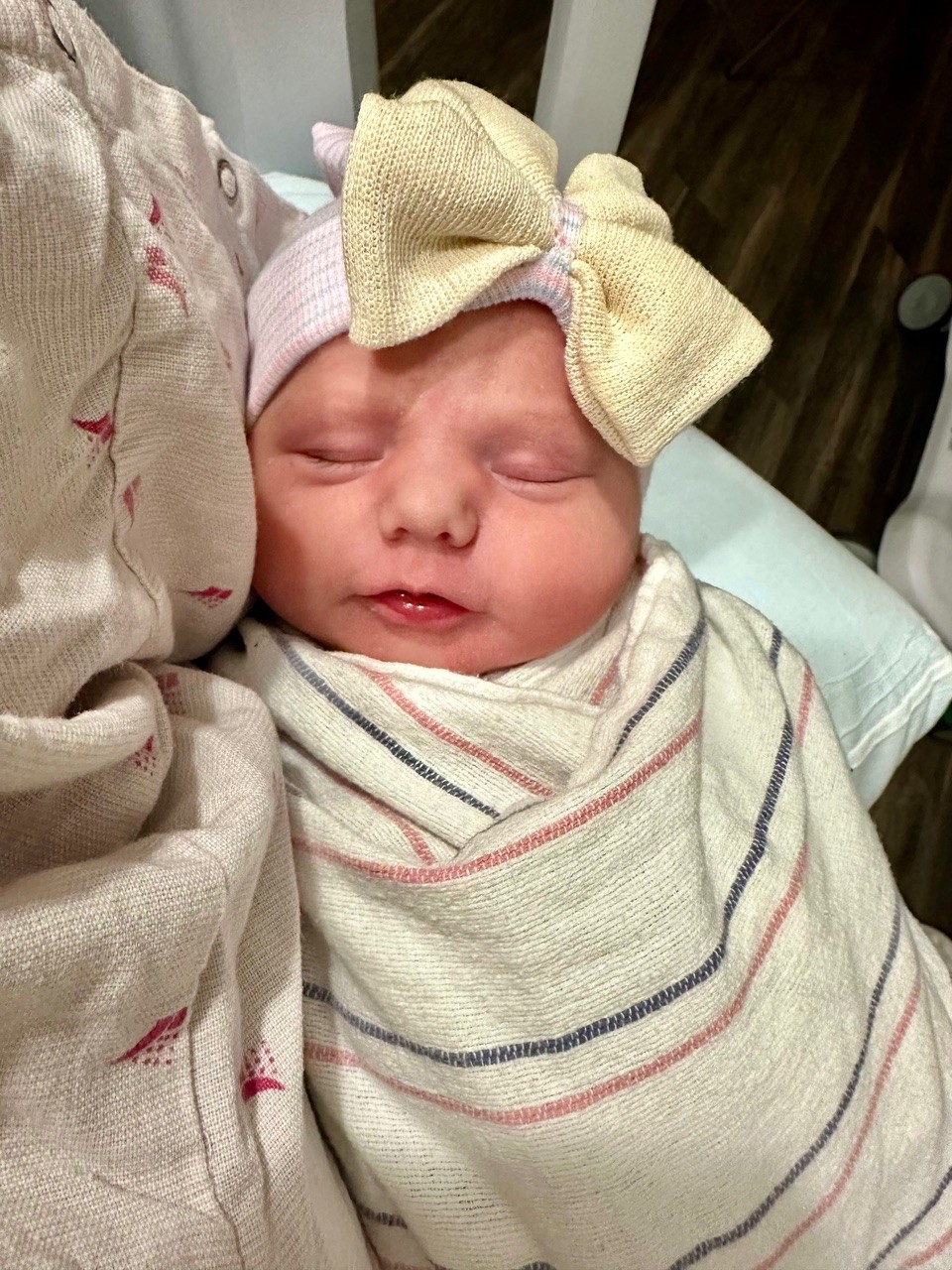 Sweet baby Evelyn, smiling with angelic innocence and light.